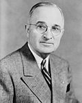 Harry S Truman, bw half-length photo portrait, facing front, 1945-crop.jpg